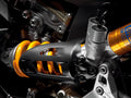Carbon cover for rear shock absorber.
