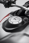 Hands-free tank filler plug.