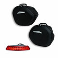 Pair of semi-rigid side panniers.